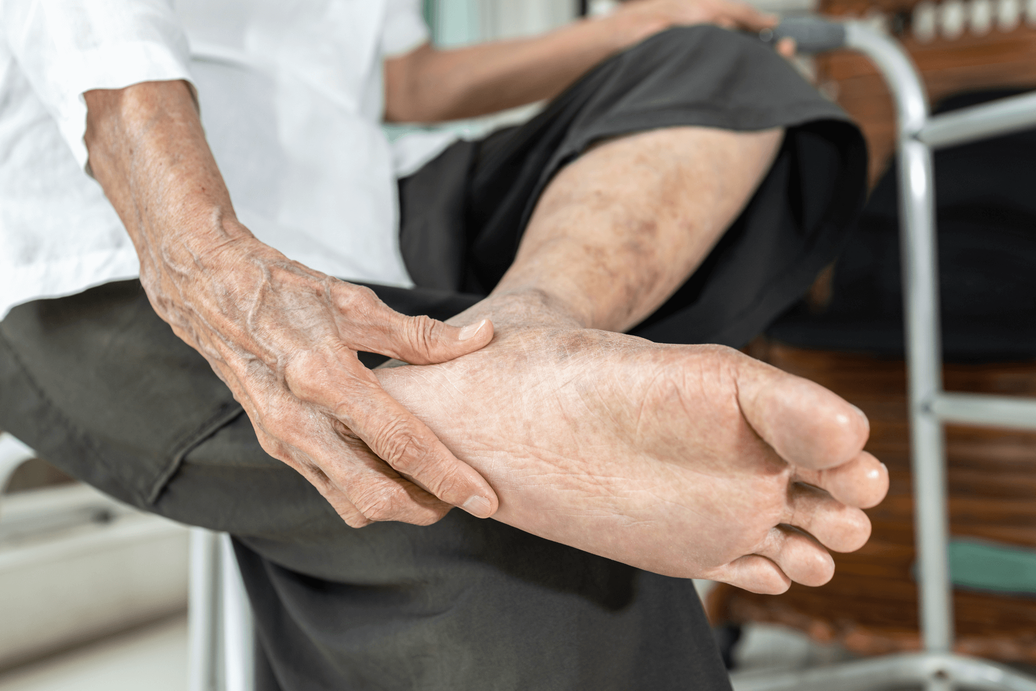 Elderly woman massage her foot,Plantar fasciitis,pain in soles of foot and heel bone,Tarsal tunnel syndrome,compression of a nerve in foot or Achilles tendonitis,inflammation of tendon at back of heel