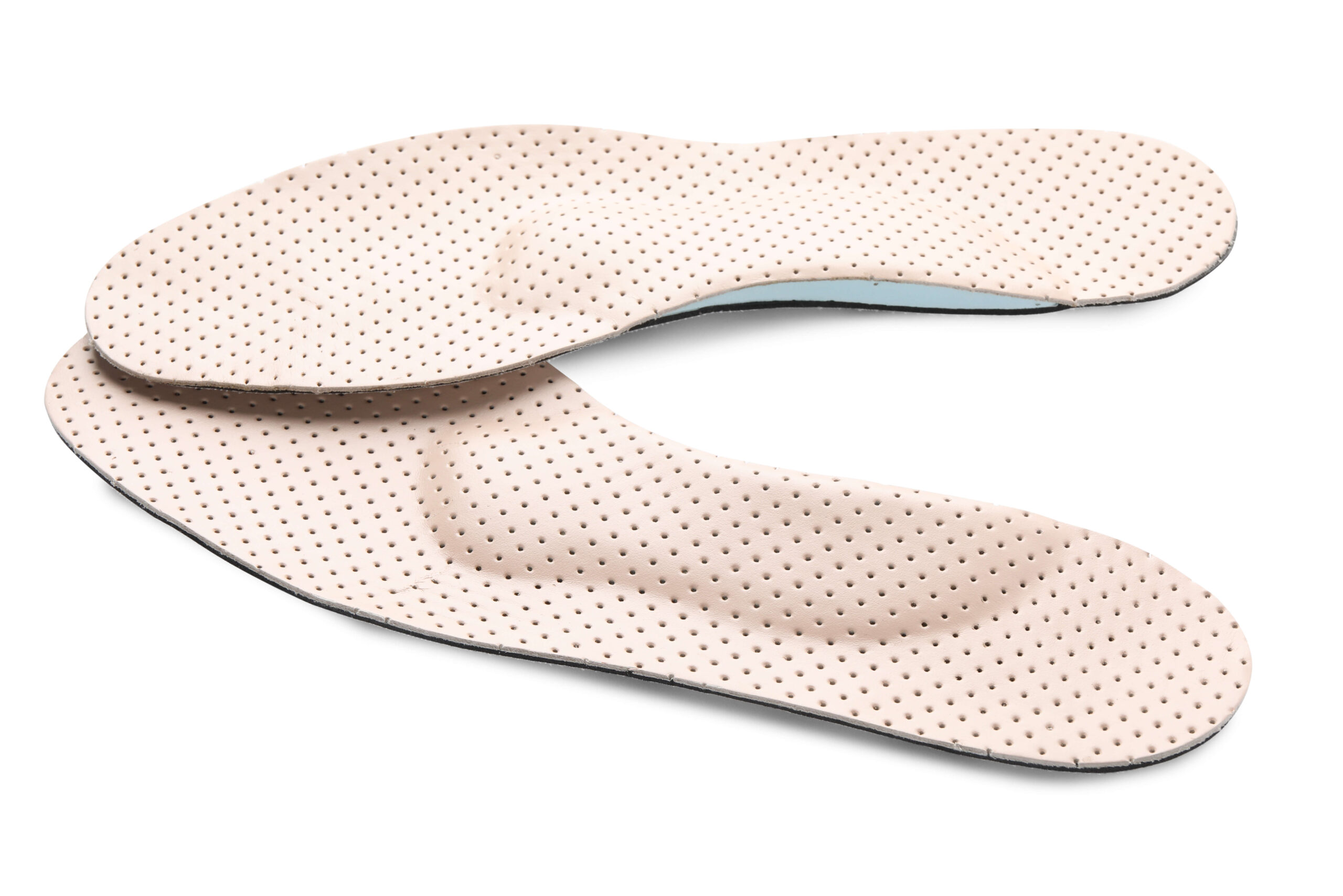 Beige comfortable orthopedic insoles isolated on white