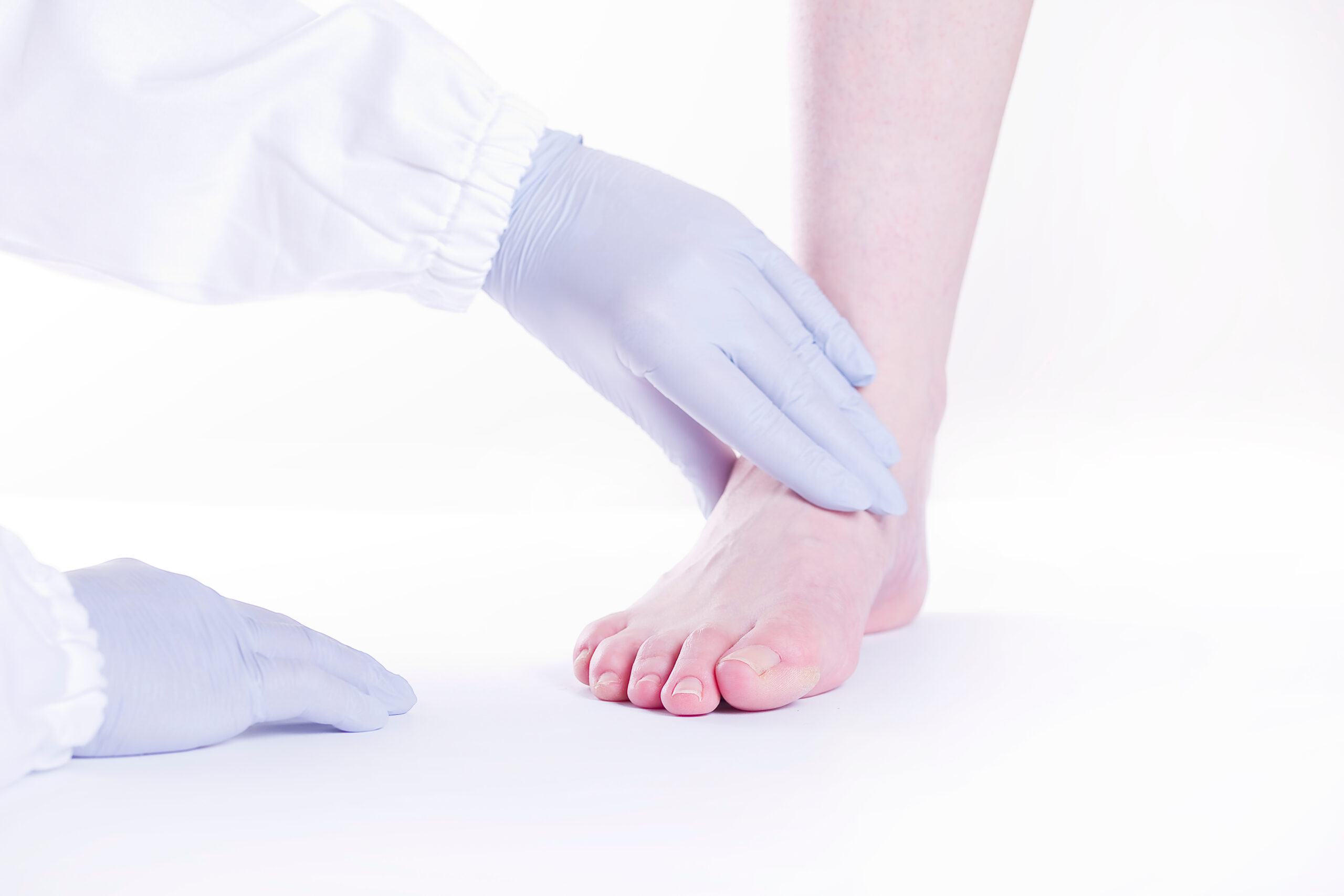 Foot doctor examining toenails