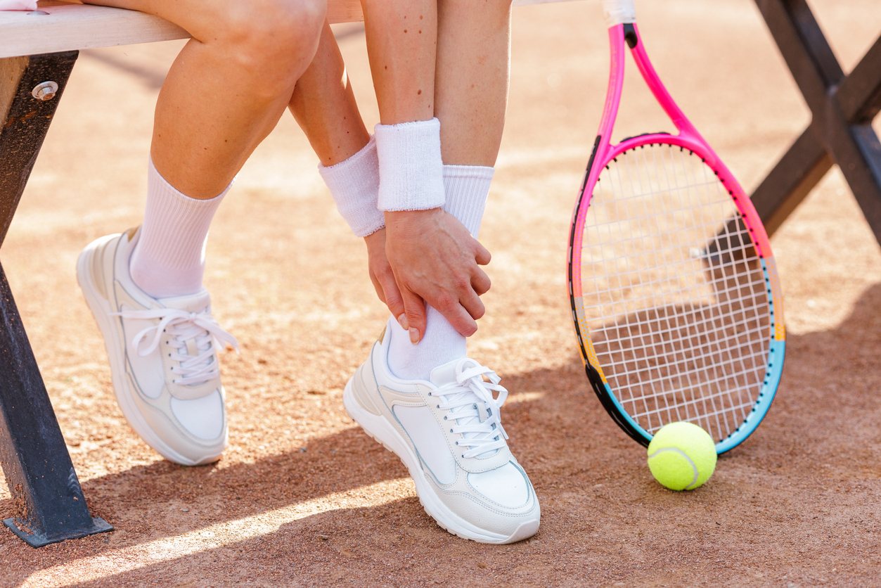 Podiatrist treating an ankle sprain
